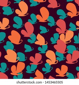 A seamless vector pattern with colorful butterflies silhouettes on dark background. Surface print design.