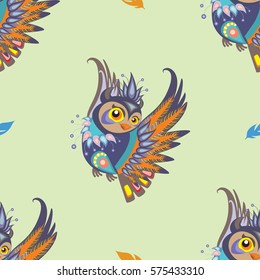 Seamless vector pattern with colorful cartoon owl and blue and orange feathers on green background