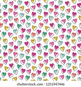 Seamless vector pattern with colorful cute hearts.