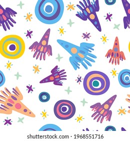 Seamless vector pattern colorful design detailed illustration of rockets, spaceships and planets in bright tones. The design is perfect for wallpaper, wrapping paper, packaging, textiles, clothes