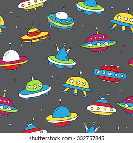 Seamless vector pattern of colorful flying saucers ufo on a dark gray background, hand-drawn.
