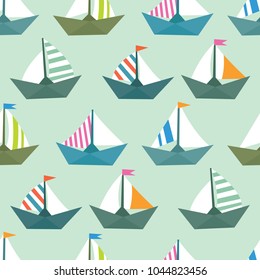 Seamless vector pattern with colorful paper ships. Sea texture
