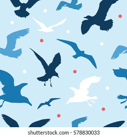Seamless vector pattern with colorful seagulls on blue background
