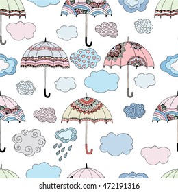 Seamless vector pattern with colorful umbrellas and clouds. Hand drawn doodle background. Texture for the banner, advertising, posters, textile, web design. Cartoon autumn wallpaper