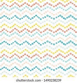 Seamless vector pattern. Colorful zig zags of small circles