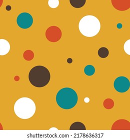 Seamless vector pattern with colourful dost on retro yellow background. Simple party spots wallpaper design. Decorative happy fashion textile.