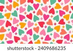 Seamless vector pattern of colourful hearts in bright vibrant colours on light background. Valentine