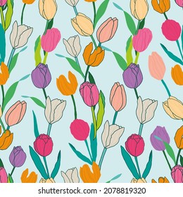 patrón vectorial transparente con tulipanes coloridos dispuestos en filas sobre un fondo azul claro