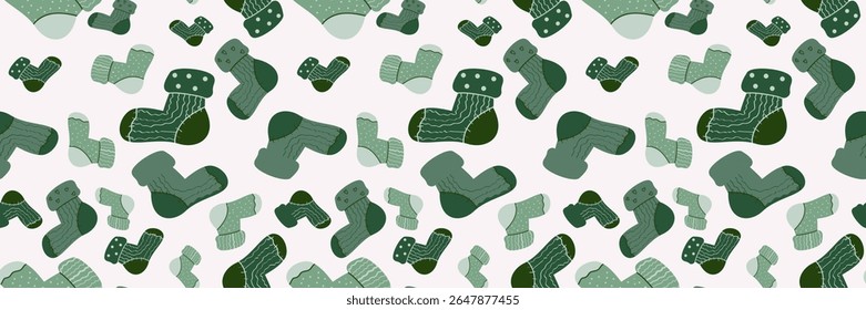 Seamless vector pattern of cozy green socks with various patterns on a soft pink background. Ideal for winter fashion, holiday textiles, digital decor, and warm, comfortable designs.