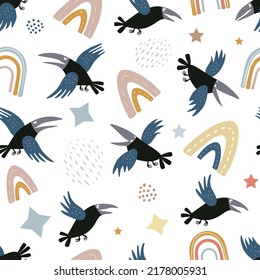 Seamless vector pattern with crows or ravens, rainbows and stars isolated on a white background. Hand drawn print for children.