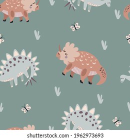 Seamless vector pattern with cute animal dinosaurs on a green background. Creative animal texture. Great for baby fabrics, textiles and designs