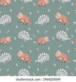Seamless vector pattern with cute animal dinosaurs on a green background. Creative animal texture. Great for baby fabrics, textiles and designs	
