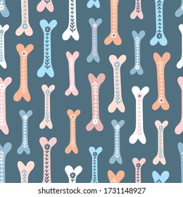 Seamless vector pattern with cute bones for dogs and flowers. Blue background.