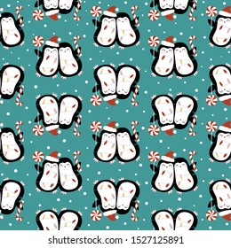 Seamless vector pattern with cute Christmas penguins on green background. Perfect for textile, wallpaper or print design. You can find the matching logo in my Christmas set.