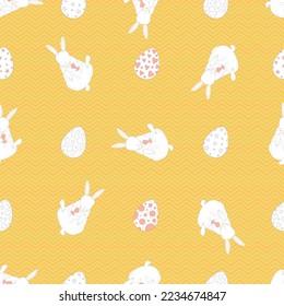 Seamless vector pattern. cute Easter Bunny. colored egg. simple pattern on yellow background