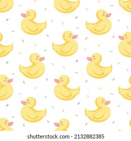 Seamless vector pattern with cute hand drawn rubber duckling and confetti. Kawaii animal background for kids room decor, nursery art, card, gift, fabric, textile, wrapping paper, wallpaper, packaging.