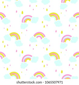 Seamless vector pattern with cute rainbow and clouds.