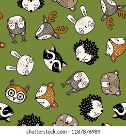 Seamless vector pattern with cute woodland animals on green background. 