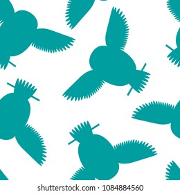 Seamless vector pattern with cyan, teal owls. Repetitive background with vector flat birds turquoise, aqua, green-blue color. Owls in the repetitive seamless vector pattern.