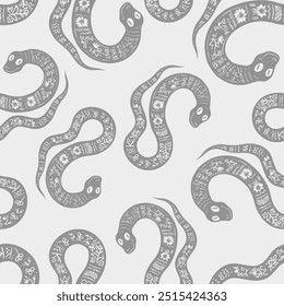 Seamless vector pattern decorated snake with Ukrainian embroidery, the animal symbol of 2025. Simple doodle style. Grid