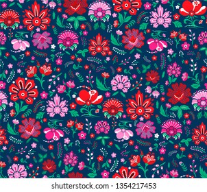 Seamless vector pattern. Decorative floral template. Green background with multicolor leaves and flowers. Pattern for fabric and textile. Spring summer field of flowers wallpaper.
