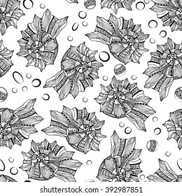 Seamless vector pattern of decorative seashells isolated on white background. Zentangl. Boho style.