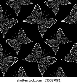 Seamless vector pattern. Delicate butterflies on a dark background.