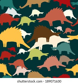 Seamless vector pattern of dinosaurs silhouettes