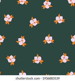 Seamless vector pattern Ditsy pansy flowers. Delicate pink small scattered flowers on a green background. Cute romantic Folk art flowers for fabric, nursery, home decor, wallpaper, spring decor.