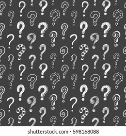 Seamless vector pattern with doodle questions marks on a blackboard background