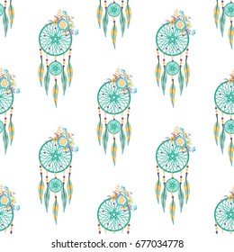 Seamless vector pattern of dream catchers on a white background with flowers.