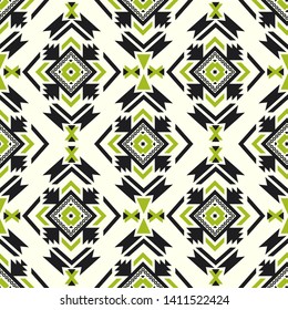 Seamless vector pattern in ethnic style. Background with tribal ornament of geometric shapes. Image for printing on paper, wallpaper, covers, textiles, fabrics, clothing and other