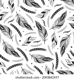 Seamless vector pattern of feathers and beads. Brutal ethnic monochrome pattern