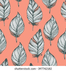 Seamless vector pattern with feathers in bohemian style on pink. Ink drawn vector illustration for prints, fabric, wrapping and other design.