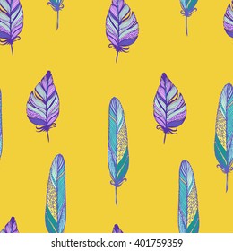 Seamless vector pattern with feathers in bohemian style on yellow. Ink drawn vector illustration for prints, fabric, wrapping and other design.
