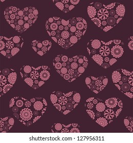 Seamless vector pattern with floral  hearts on burgundy background