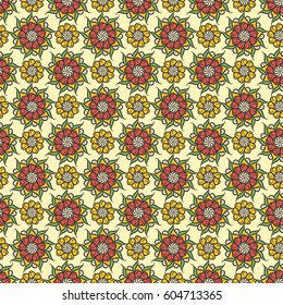 Seamless vector pattern with floral motif in a palette of yellow, red and green colors
