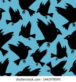 Seamless vector pattern with flying black birds on bright blue background. Animal wallpaper design with crow silhouettes.