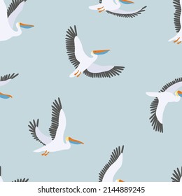 Seamless vector pattern with flying pelicans on a blue background. Graphic print with birds.