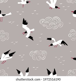 Seamless vector pattern with flying seagulls and clouds on a grey background.  Sea or river bird. Vector illustration.
