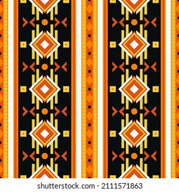 Seamless vector pattern with geometric vertical ornament. Textile print in boho style. Ethnic design with folk motifs of Maya, Aztecs, Mexicans. 