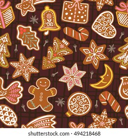 Seamless vector pattern with gingerbread cookies on brown background. Christmas vector wallpaper