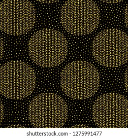 Seamless vector pattern gold glittering polka dot on black background