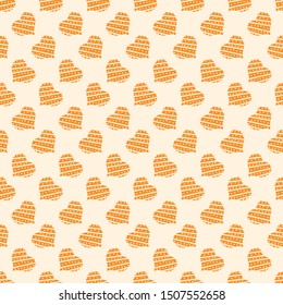 A seamless vector pattern with golden hearts. Surface print design.