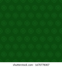 Seamless vector pattern with green clover leaves, shamrock on a dark green backdrop for St. Patrick's Day. Spring fest background for greetings card, flyer, decor, print, packaging design and more.