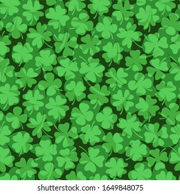 Seamless vector pattern with green four leaf clovers for Saint Patrick's Day backgrounds and graphic design
