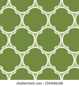 A seamless vector pattern with green geometric four leaves clover shapes. Surface print design.