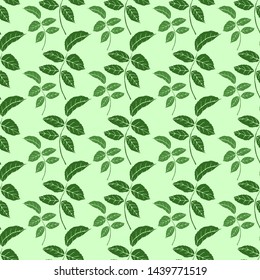 Seamless vector pattern of green leaves on the light green background. Endless texture for your textile, design, fabric, packaging.