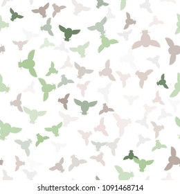 Seamless vector pattern with grey, pink, green owls. Repetitive background with vector multicolored flat birds. Owls in the repetitive seamless vector pattern.