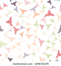 Seamless vector pattern with grey, pink, violet owls. Repetitive background with vector multicolored flat birds. Owls in the repetitive seamless vector pattern.